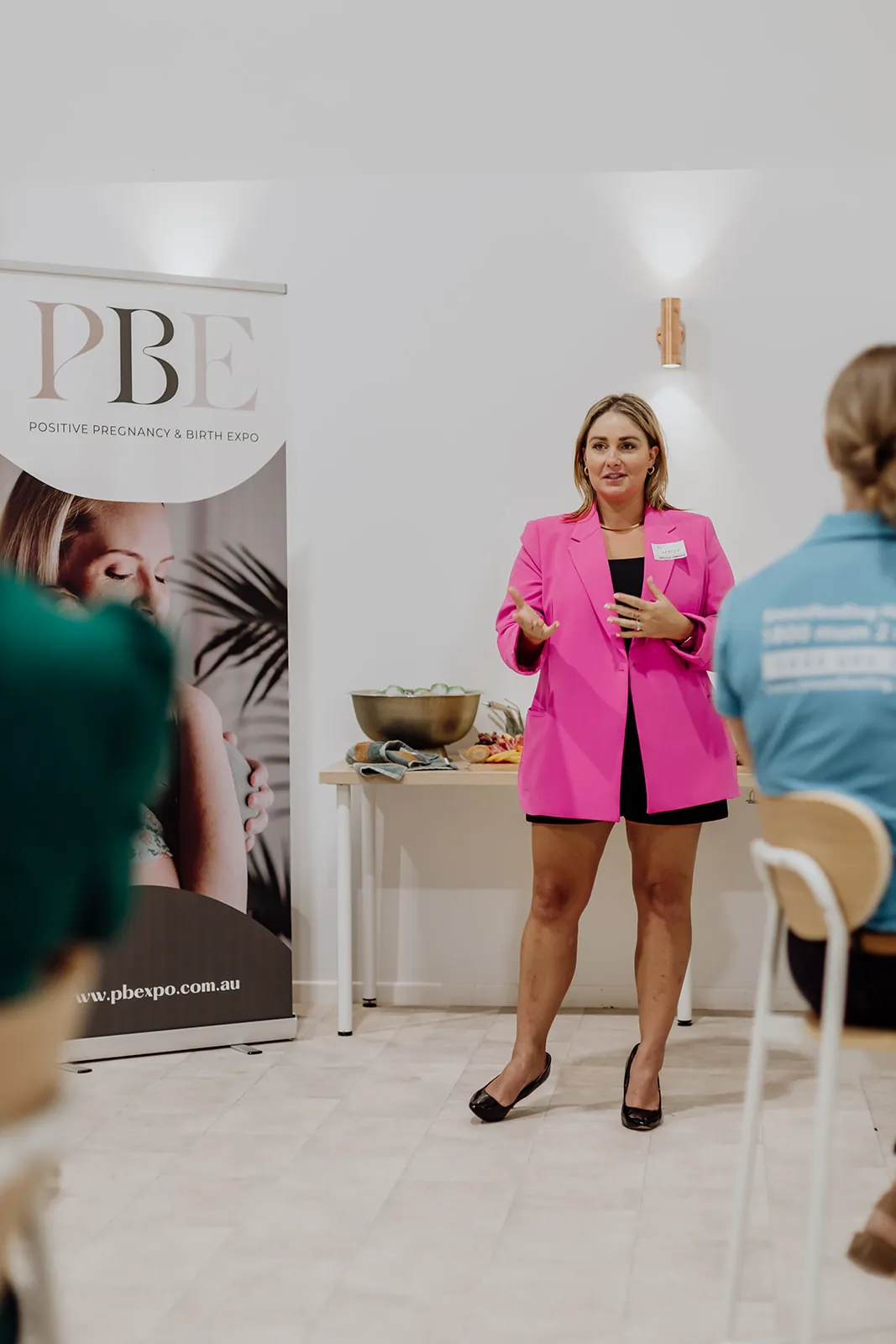 A host speaking to guests at an expo launch night at Birdcage Studios Mackay